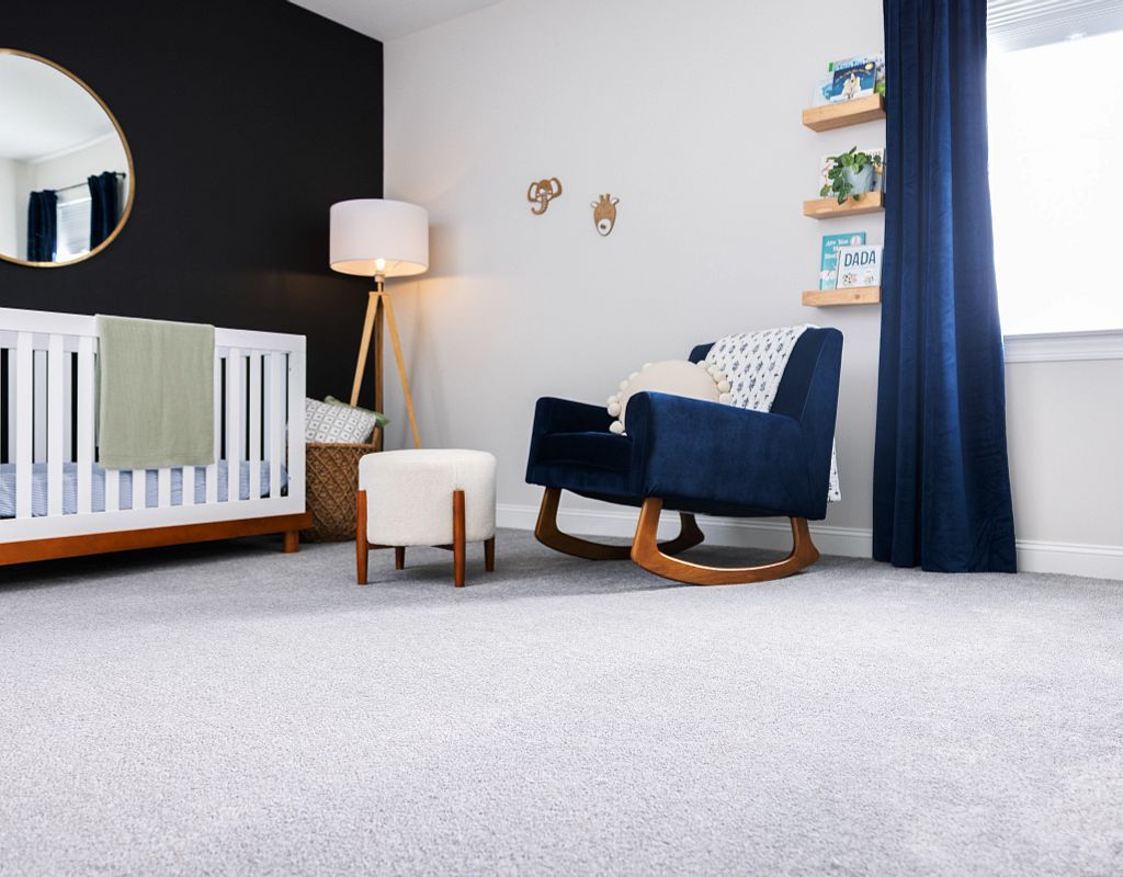 Carpet flooring with blue sofa | Flooring Installation System