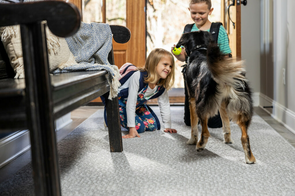 Kids playing with dog | Flooring Installation System